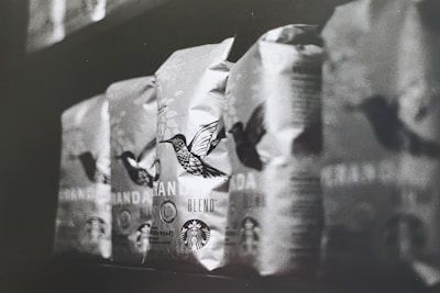 A neat row of coffee bags branded with loamx logo ready for European distribution.