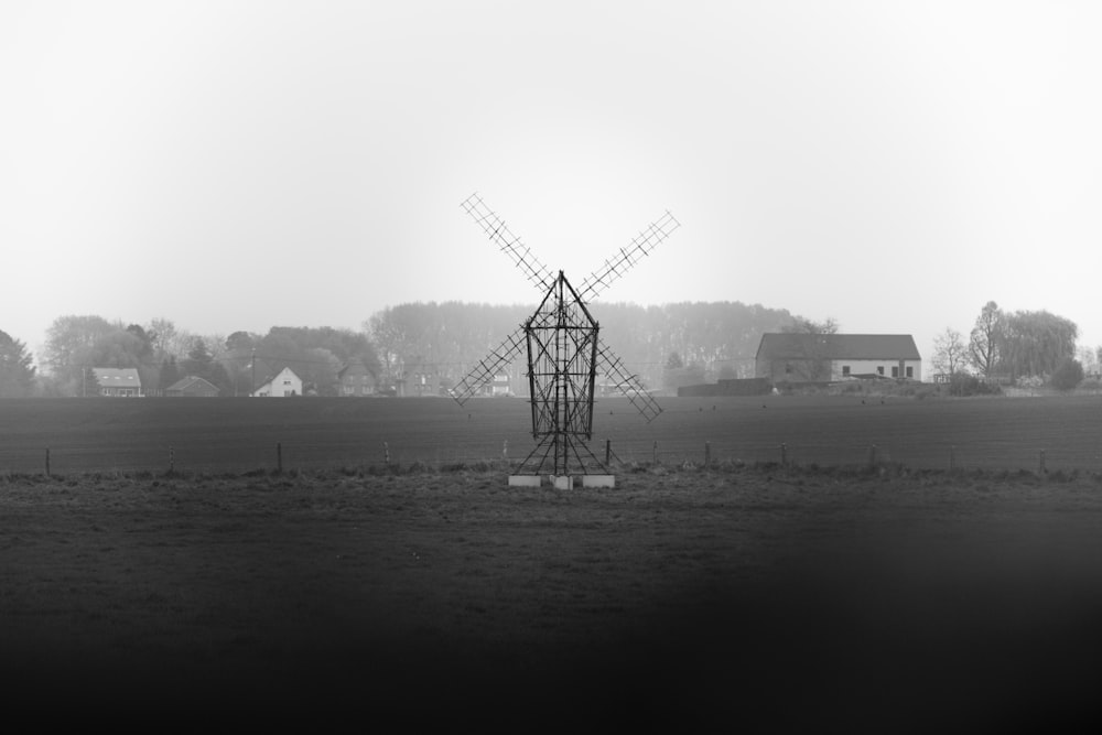 windmill near body of water