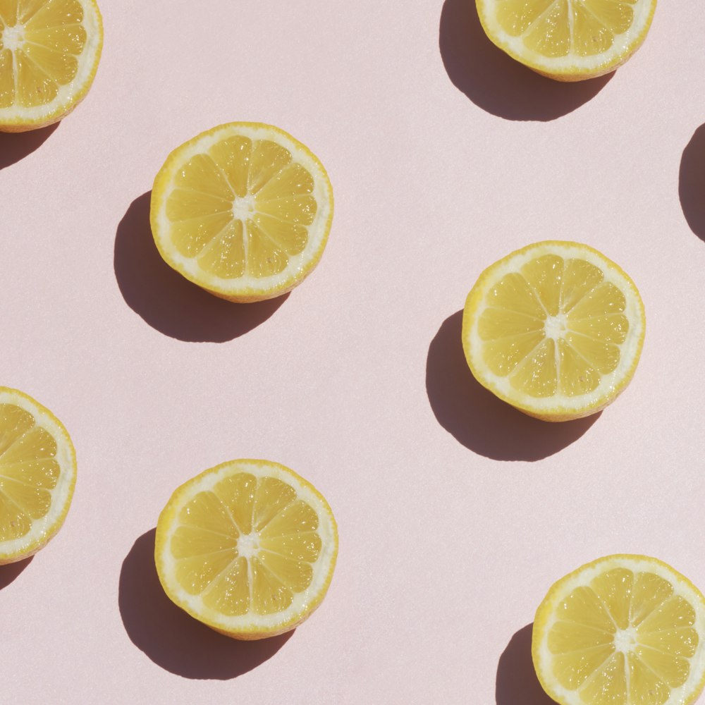 sliced lemon on white surface