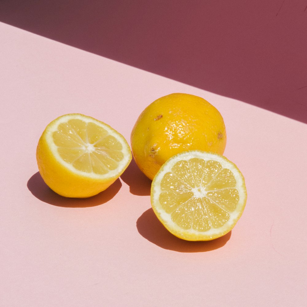 sliced lemon on orange table