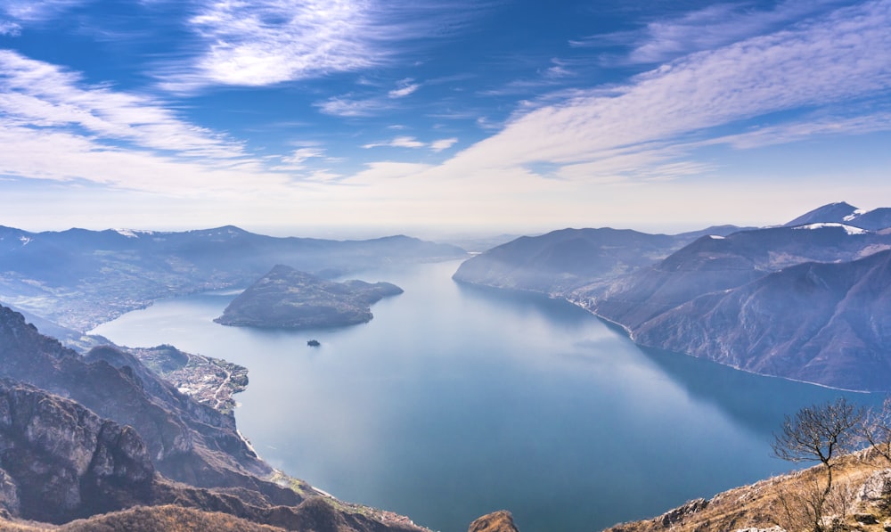 aerial view of lake and mountains during daytime