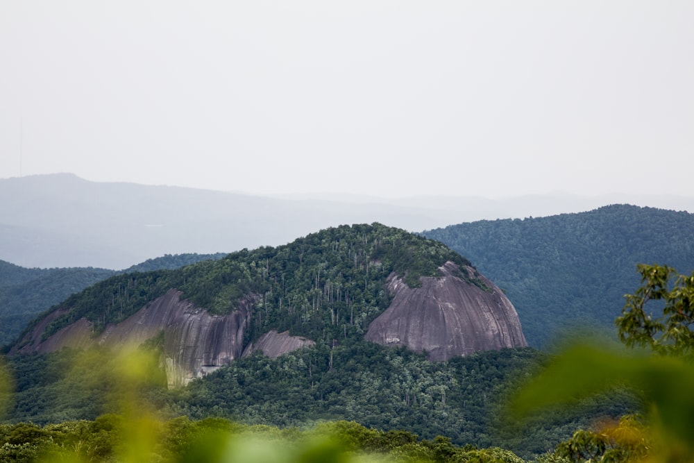 green and brown mountain under white sky during daytime