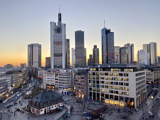 A modern cityscape of Shanghai at dusk, blending sleek skyscrapers with vibrant street life.