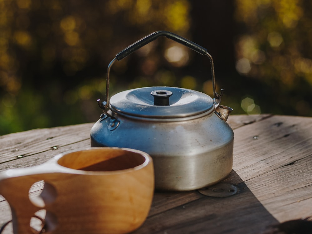 gray kettle on brown wooden table