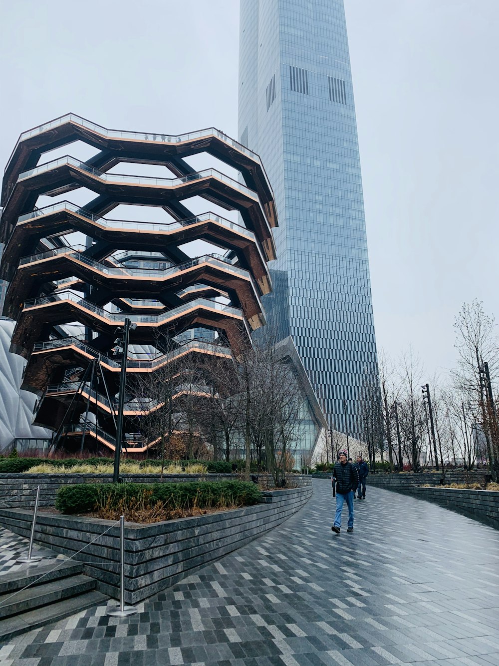 people walking on pathway near building during daytime