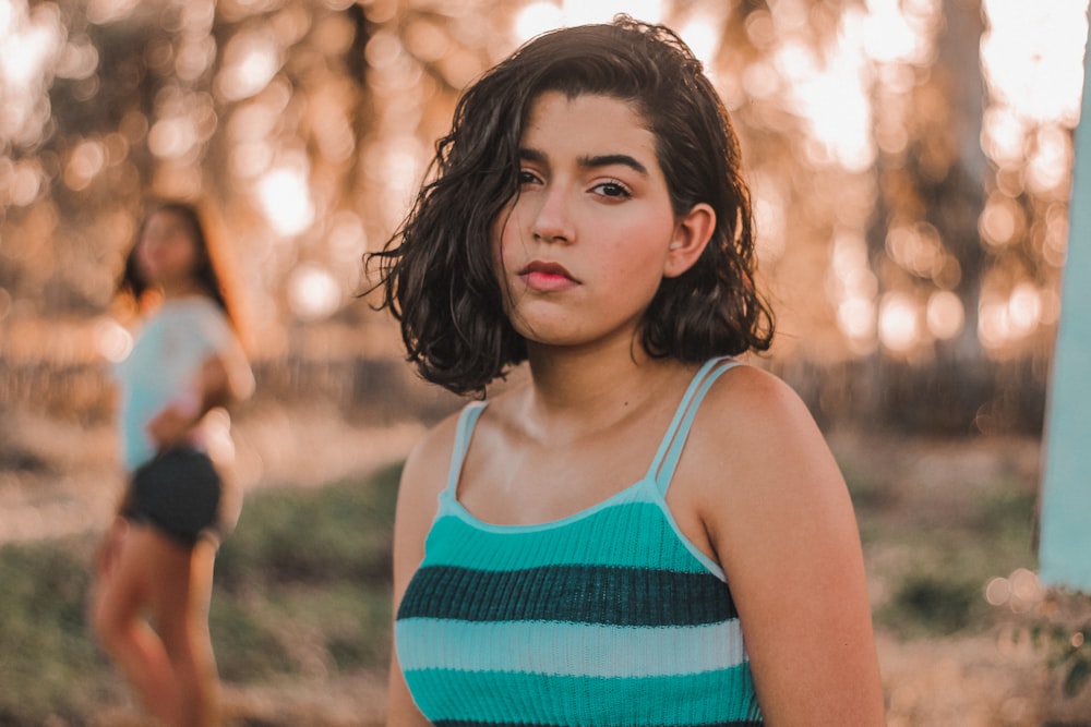 woman in green and white tank top