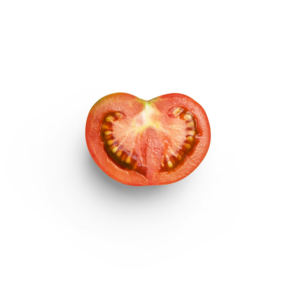 sliced tomato on white background
