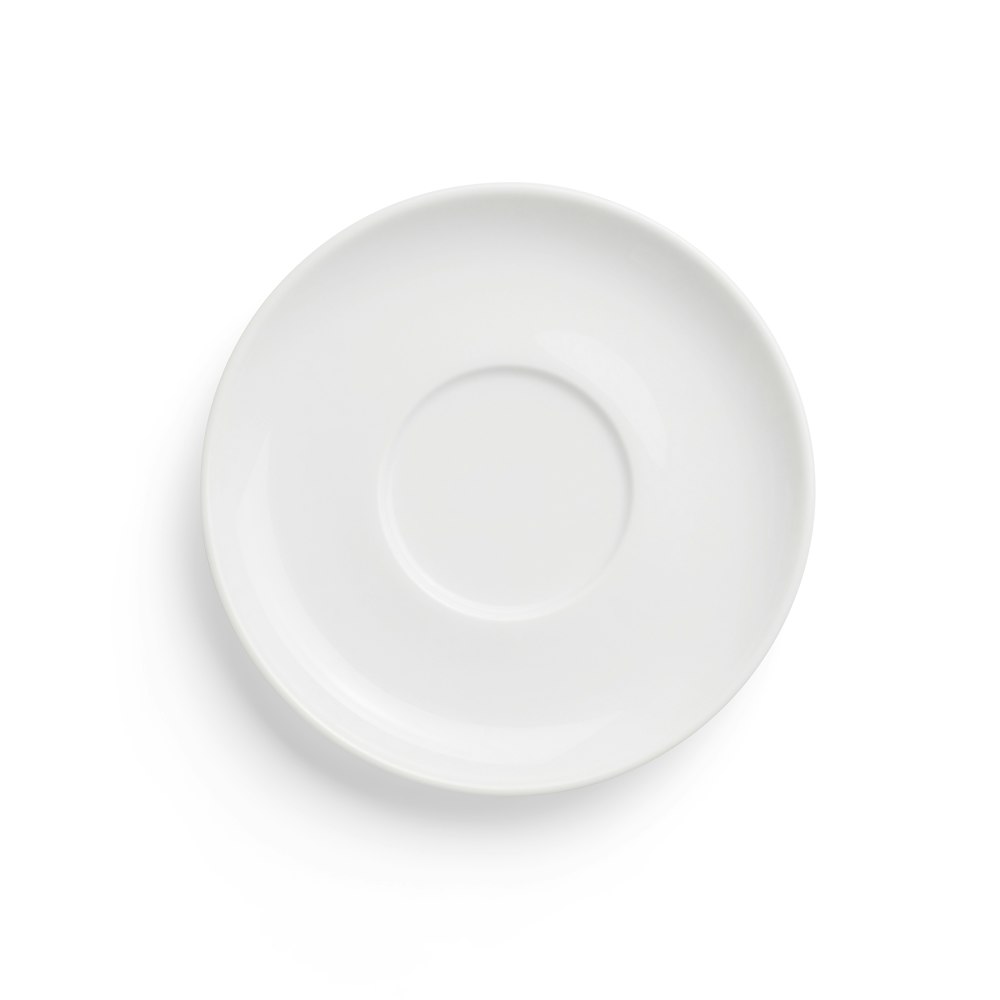 round white ceramic plate on white background