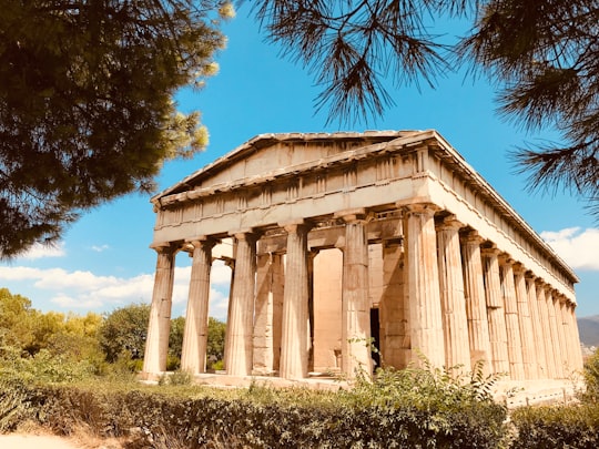 beige concrete building under blue sky during daytime in Ancient Agora of Athens Greece