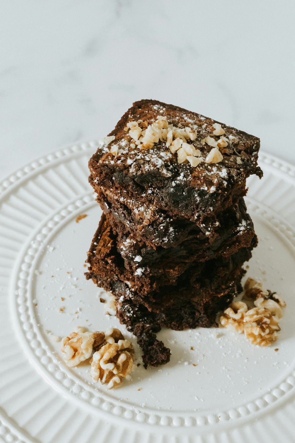 chocolate cake on white round plate