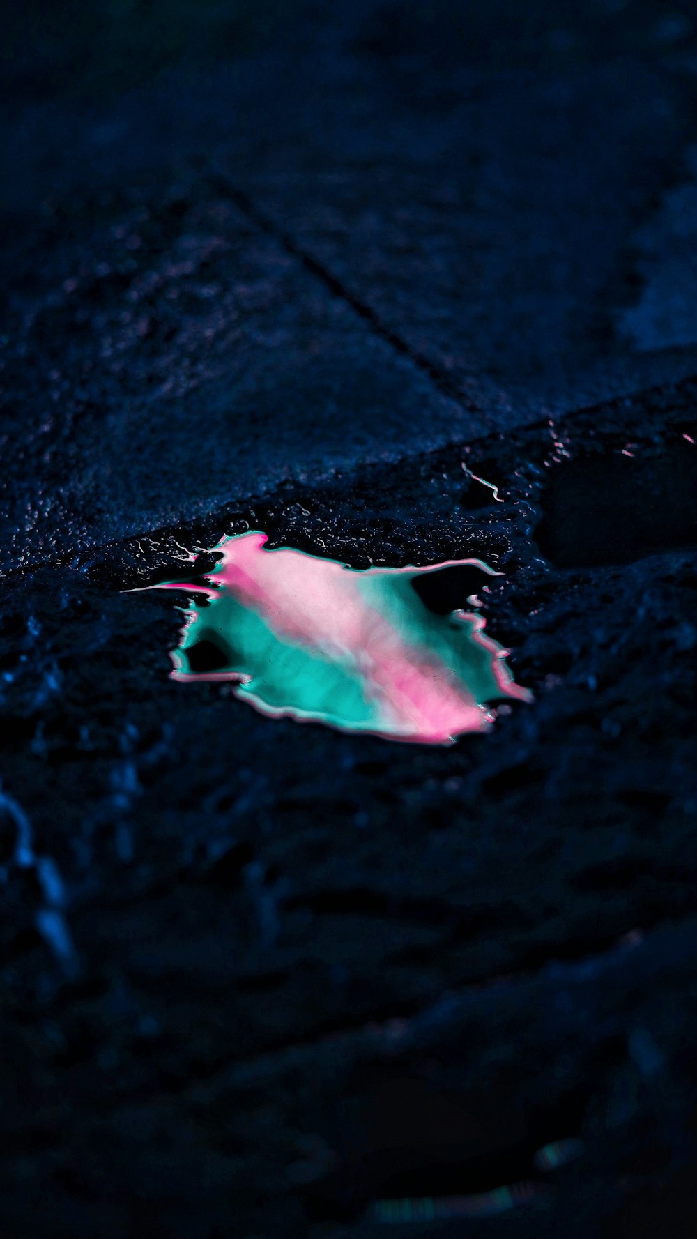 pink and white powder on black surface