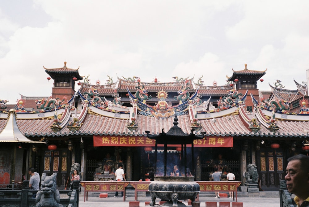 a man standing in front of a chinese building