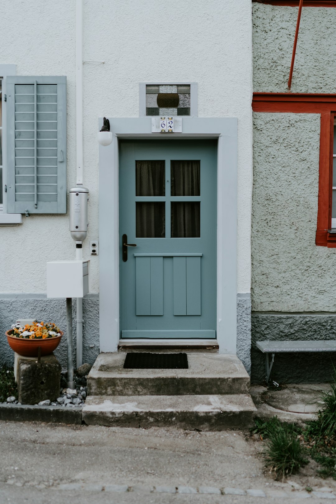 blue wooden door with white wooden frame