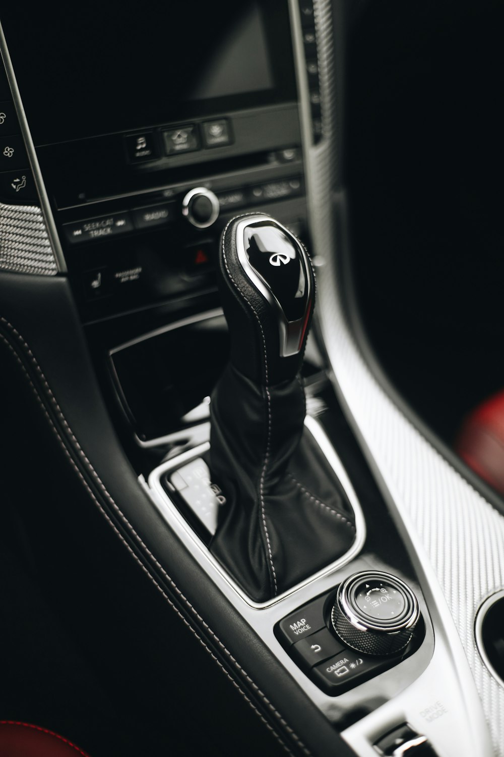 black and silver car gear shift lever