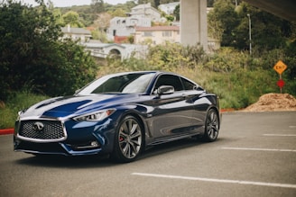 blue bmw m 3 coupe parked on gray concrete road during daytime