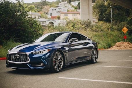 blue bmw m 3 coupe parked on gray concrete road during daytime