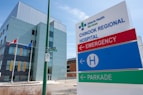 a hospital sign in front of a building