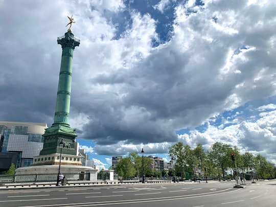 green statue under cloudy sky during daytime in July Column France