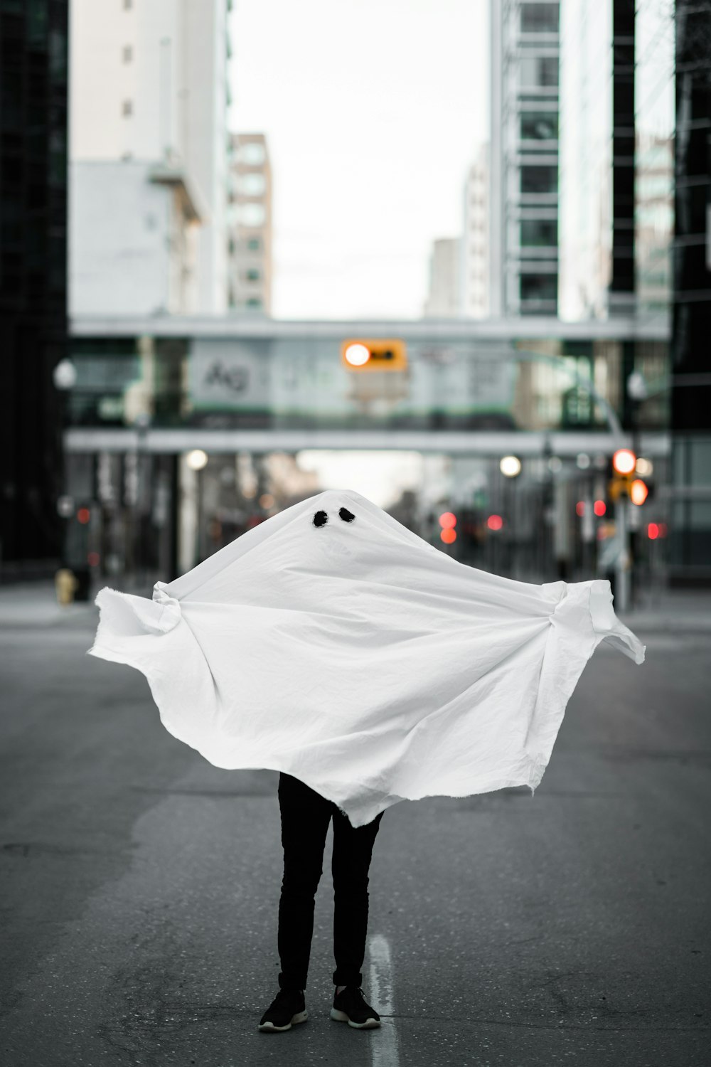 white textile on gray pavement