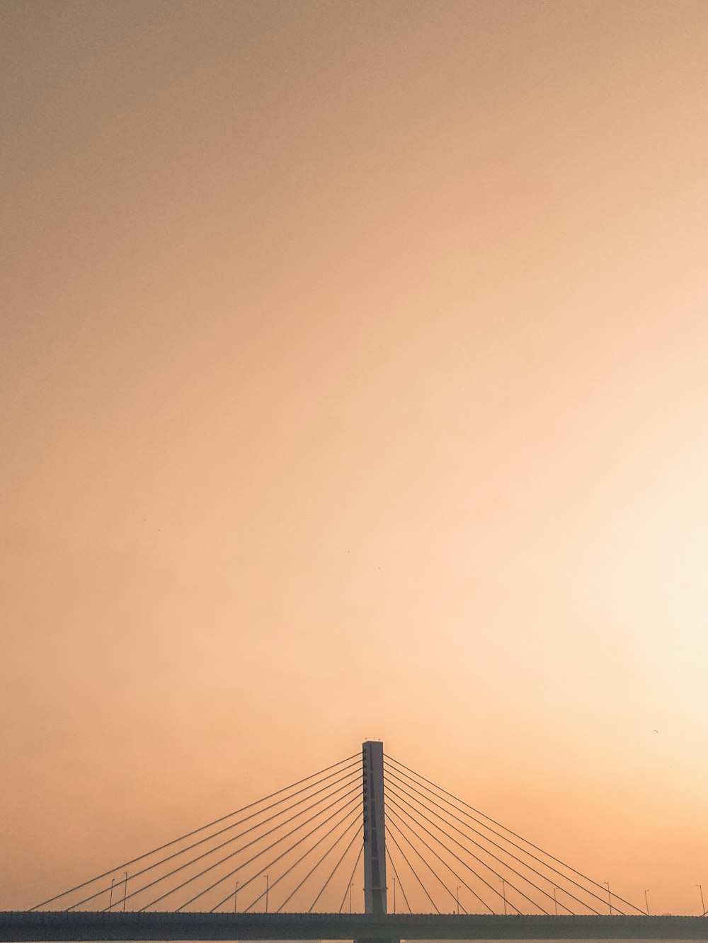 bridge under white sky during daytime