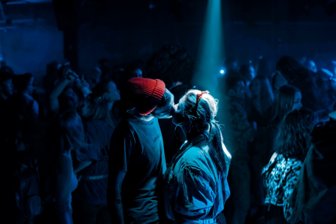 man and woman kissing on the stage