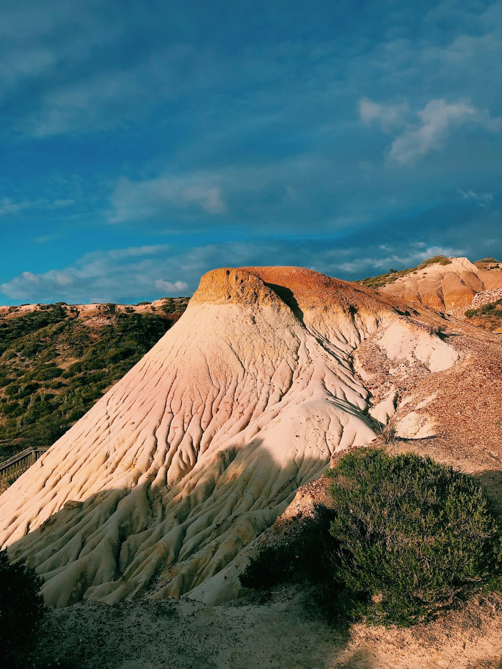 brown mountain under blue sky during daytime