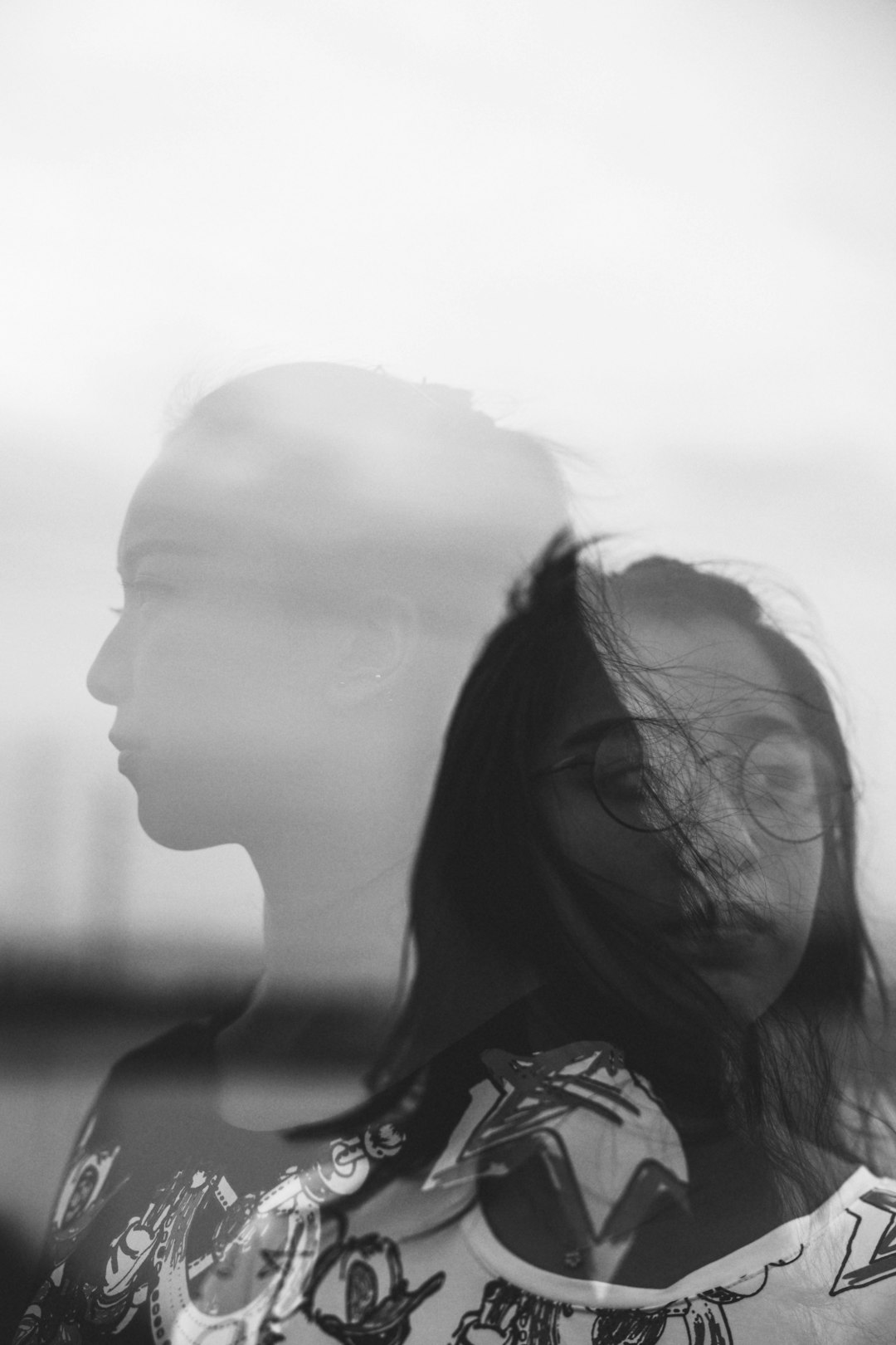 grayscale photo of woman in black and white shirt