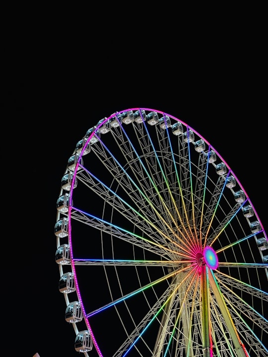 white and purple ferris wheel in Hyde Park United Kingdom