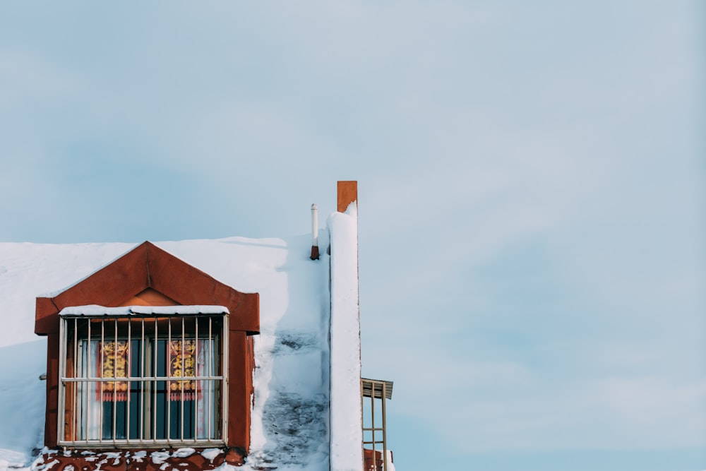 brown and white concrete house under white sky during daytime