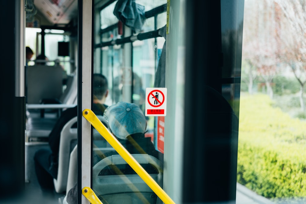 person in blue jacket sitting on yellow chair