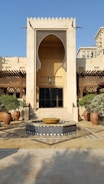 Close-up of a beautifully designed villa entrance with traditional Omani architectural elements.