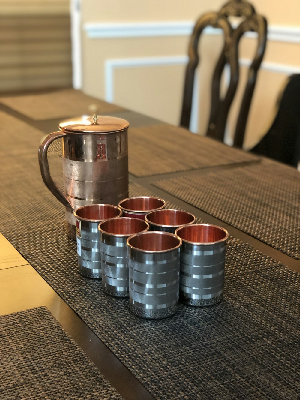 blue and red ceramic mug on table