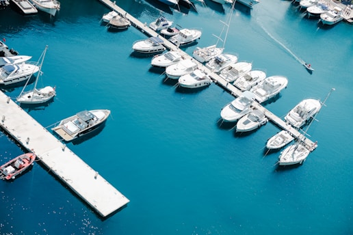 white boat on body of water during daytime
