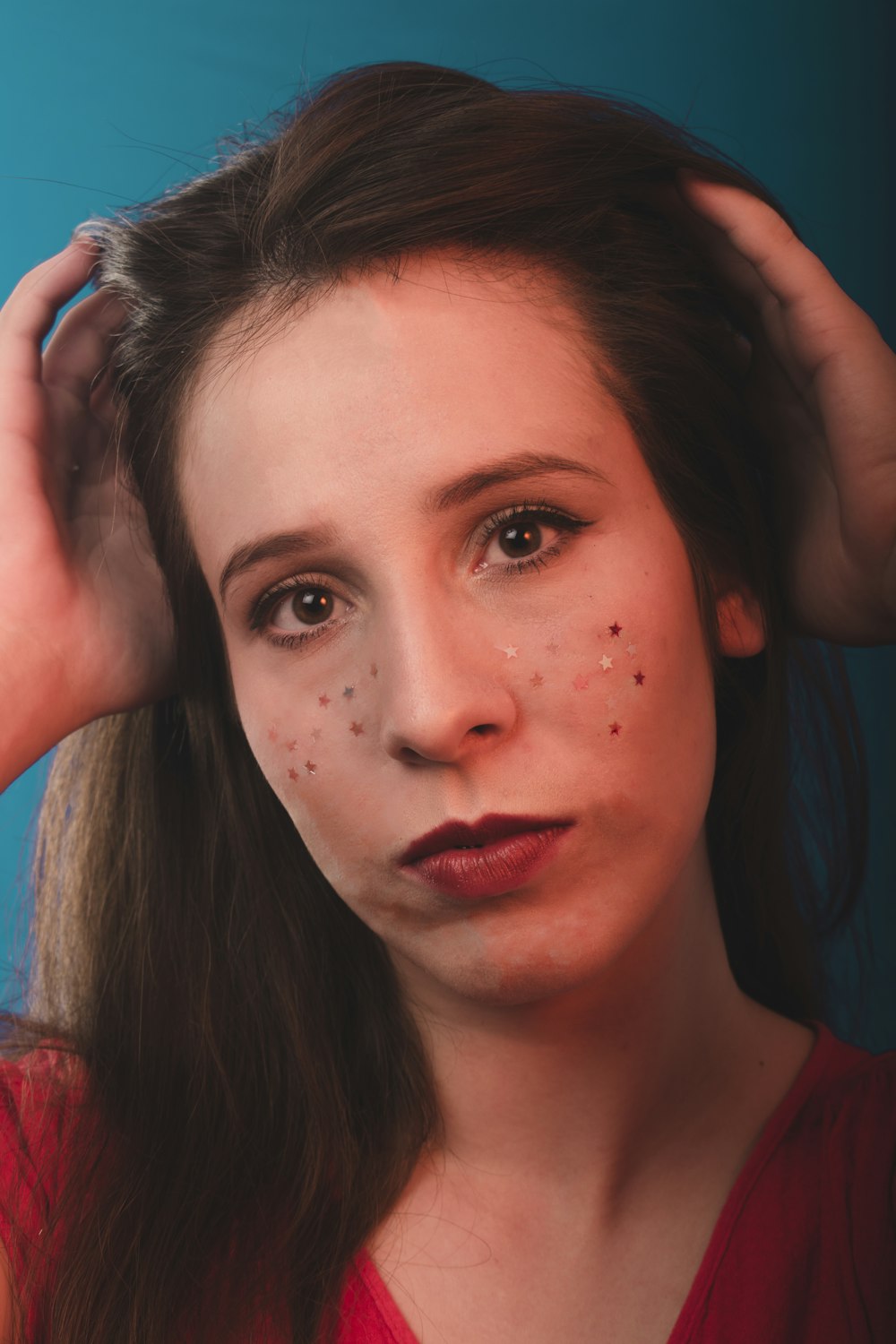 woman in red lipstick and red lipstick