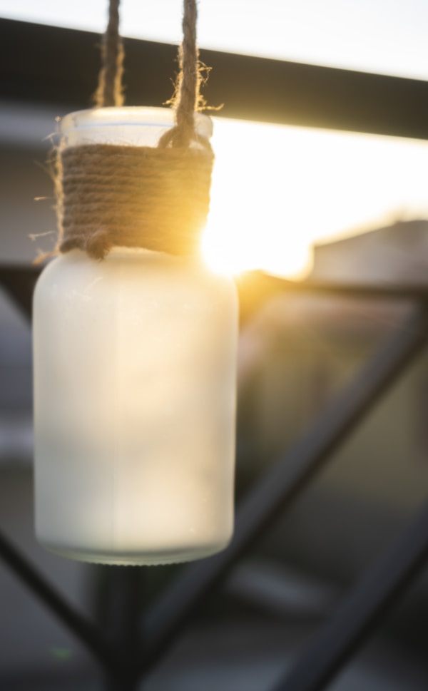 White plastic bottle with yellow powder