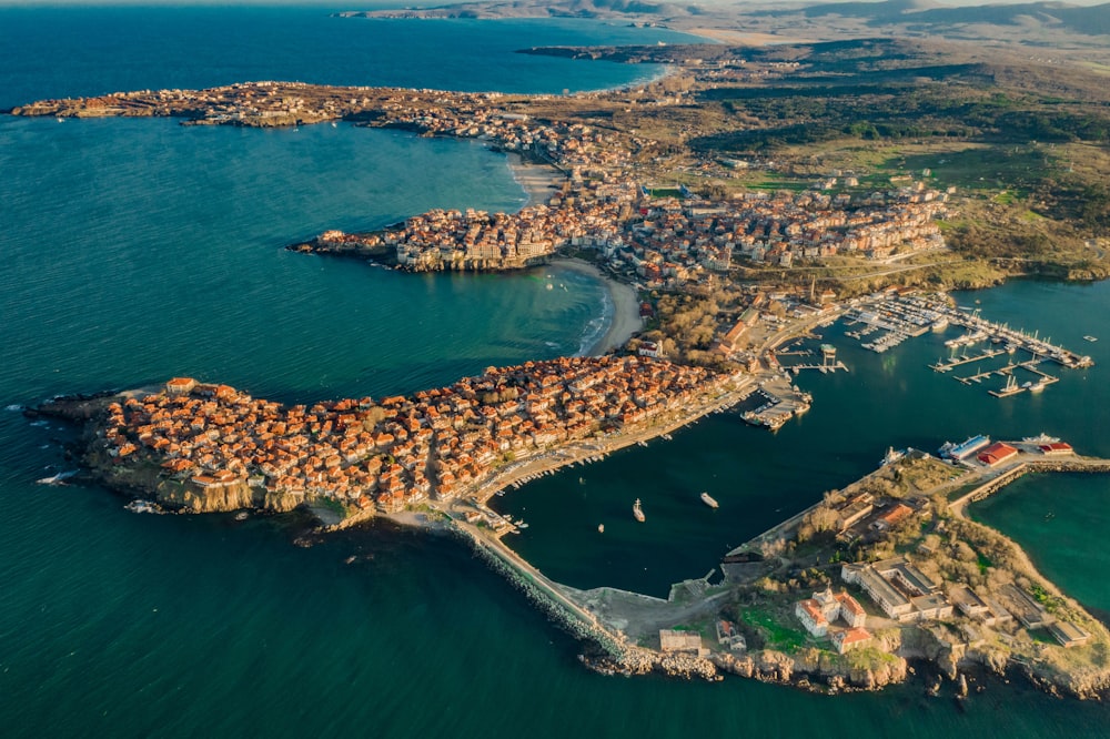 aerial view of city near body of water during daytime