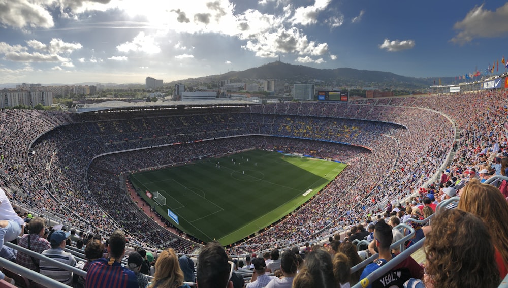 a stadium full of people watching a soccer game