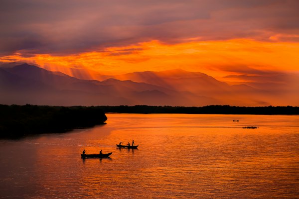 A couple of boats floating on top of a lake — Santa Marta, Colombia