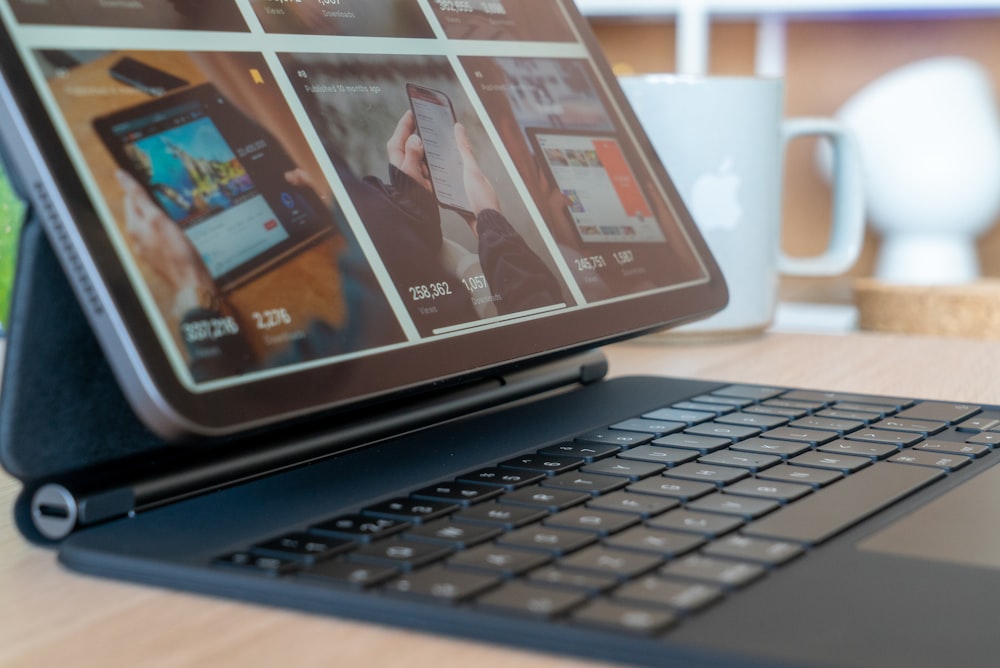 black tablet computer on black keyboard