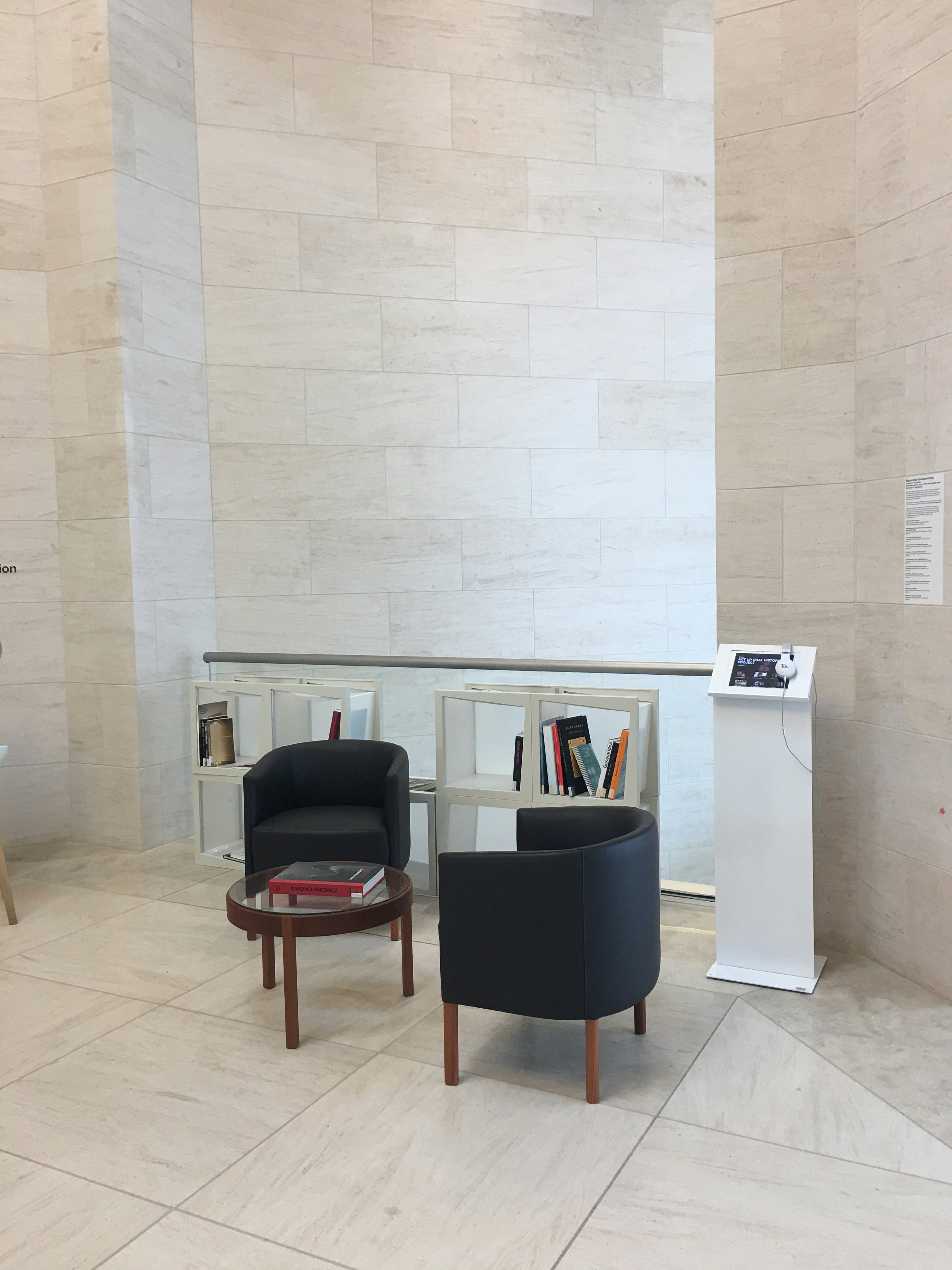 A room with two chairs and a podium