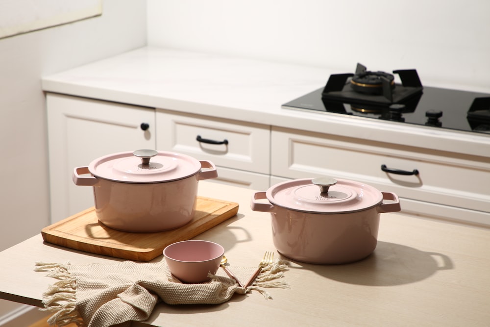 white ceramic cooking pot on white wooden table