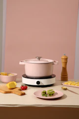 white rice cooker on brown wooden table