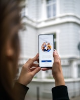 person holding white android smartphone