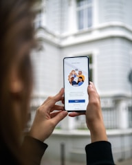person holding white android smartphone