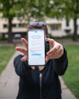 person holding silver iphone 6
