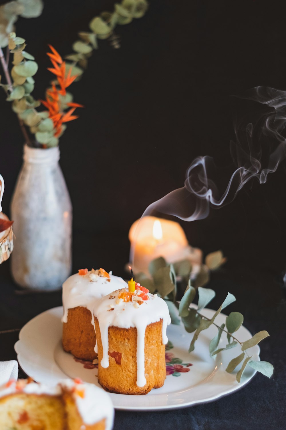 white and brown cake with white icing on white ceramic plate