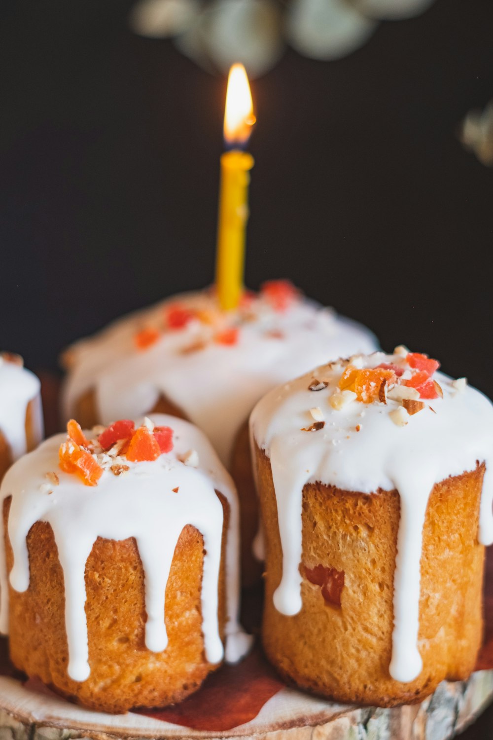 white and brown cake with white icing on top