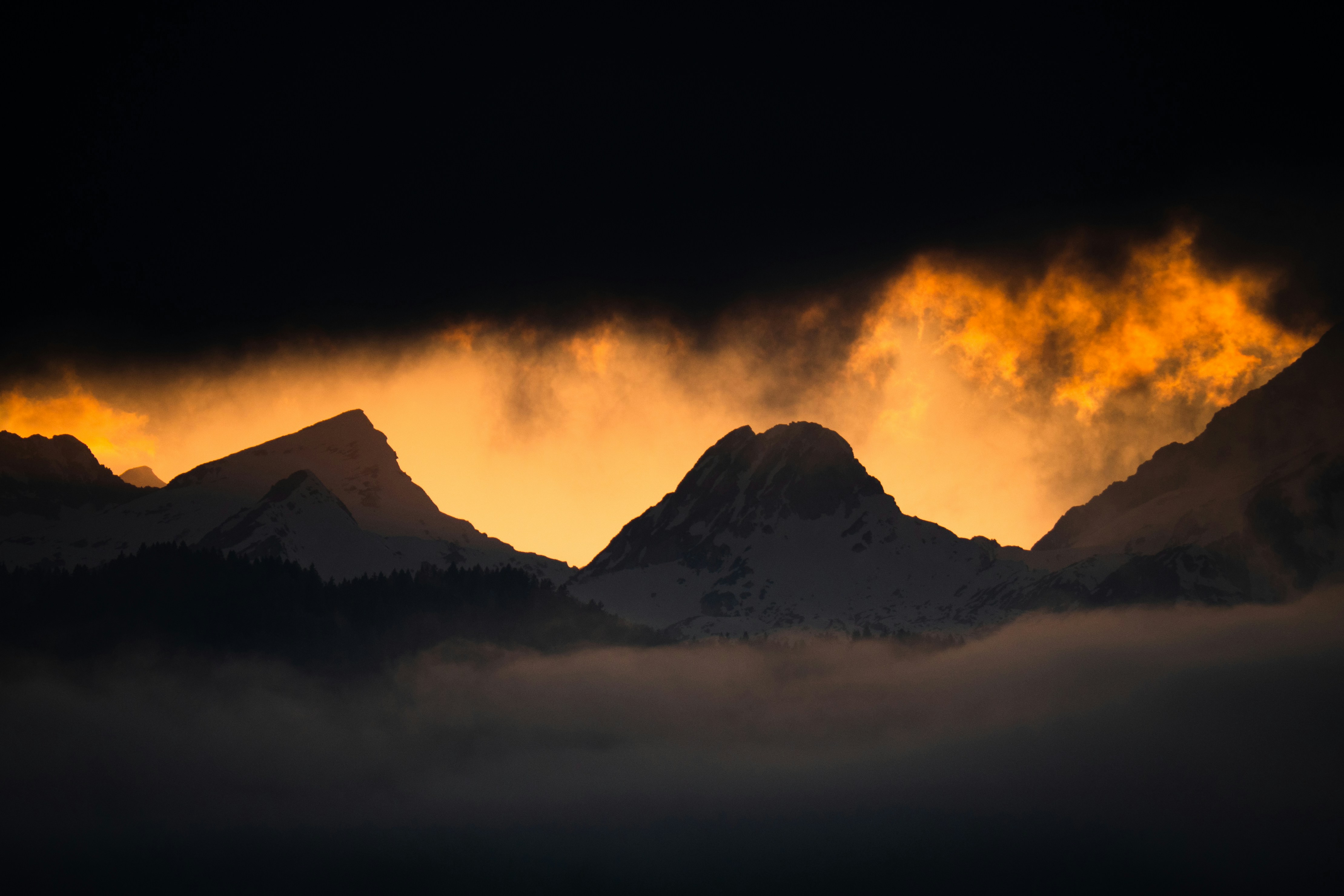 silhouette of mountains during sunset
