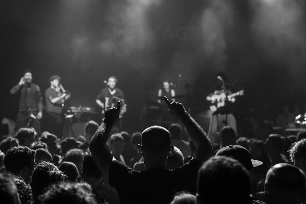 grayscale photo of people in concert