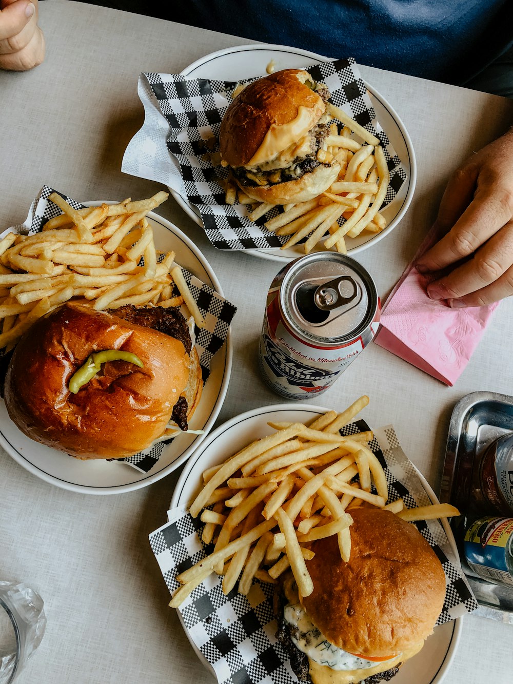 burger and fries on white ceramic plate